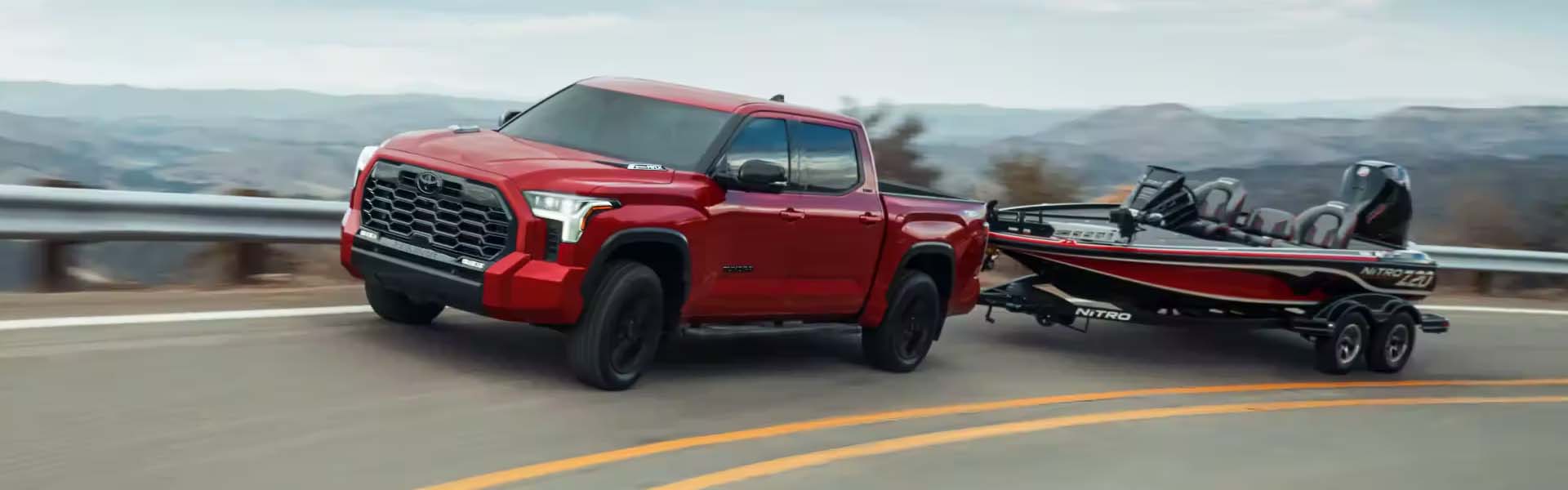 Toyota Tundra driving on a Monroe, LA road toward Karl Malone Toyota in Ruston 
